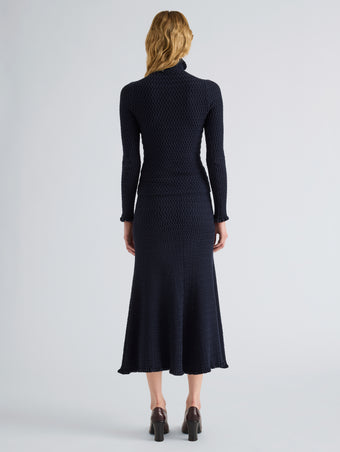 Proenza Schouler Back full length image of model wearing Magnolia Skirt in Cable Knit in Navy