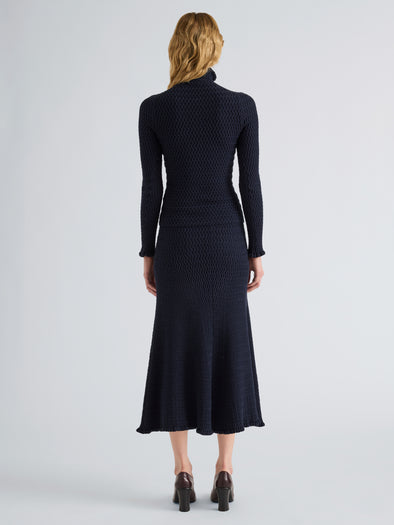 Proenza Schouler Back full length image of model wearing Magnolia Skirt in Cable Knit in Navy