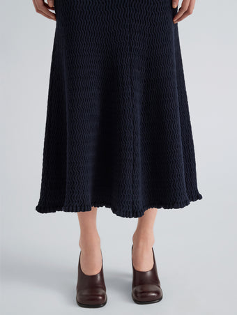 Proenza Schouler Detail image of model wearing Magnolia Skirt in Cable Knit in Navy