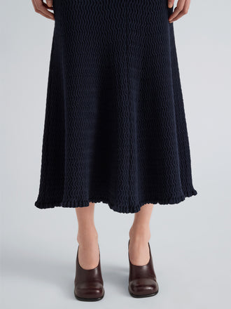 Proenza Schouler Detail image of model wearing Magnolia Skirt in Cable Knit in Navy