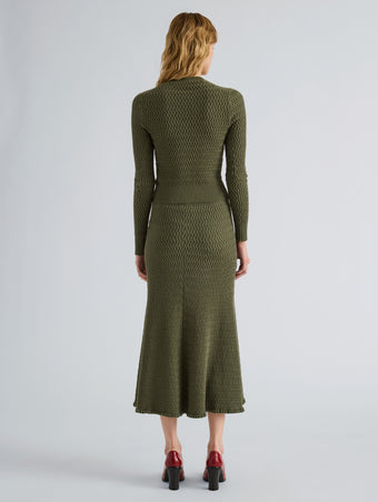 Proenza Schouler Back full length image of model wearing Magnolia Skirt in Cable Knit in Dark Olive
