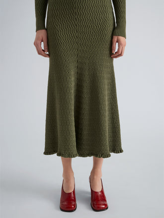 Proenza Schouler Detail image of model wearing Magnolia Skirt in Cable Knit in Dark Olive
