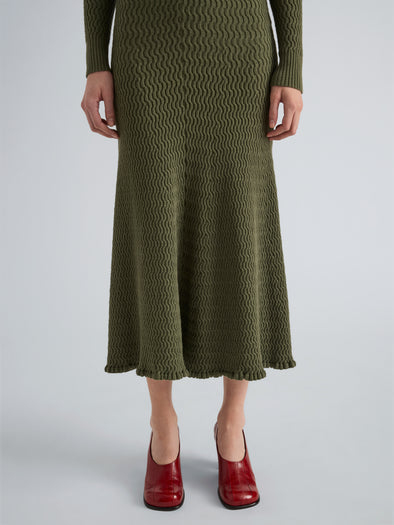 Proenza Schouler Detail image of model wearing Magnolia Skirt in Cable Knit in Dark Olive