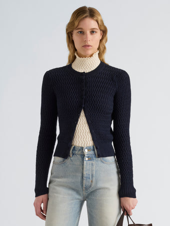 Proenza Schouler Front cropped image of model wearing Marci Cardigan in Cable Knit in Navy