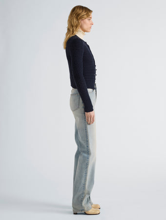 Proenza Schouler Side full length image of model wearing Marci Cardigan in Cable Knit in Navy