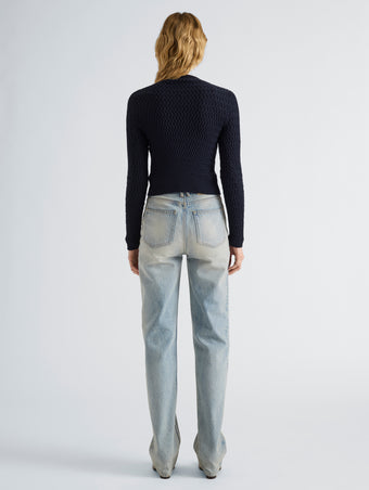 Proenza Schouler Back full length image of model wearing Marci Cardigan in Cable Knit in Navy