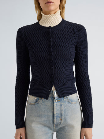 Proenza Schouler Detail image of model wearing Marci Cardigan in Cable Knit in Navy
