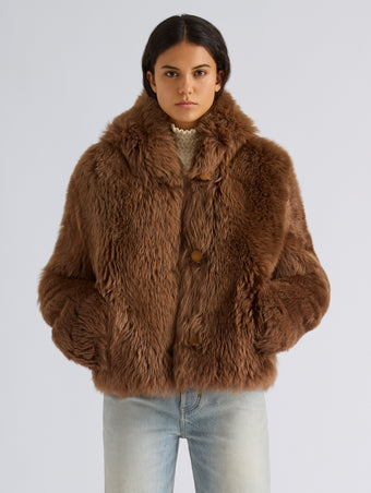 Proenza Schouler Front cropped image of model wearing Michelle Hooded Shearling in Caramel