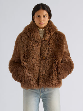 Proenza Schouler Front cropped image of model wearing Michelle Hooded Shearling in Caramel