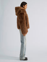 Proenza Schouler Side full length image of model wearing Michelle Hooded Shearling in Caramel