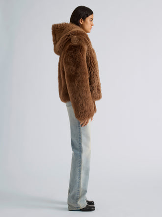 Proenza Schouler Side full length image of model wearing Michelle Hooded Shearling in Caramel
