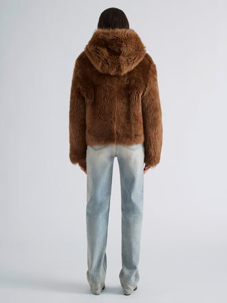 Proenza Schouler Back full length image of model wearing Michelle Hooded Shearling in Caramel