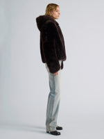 Proenza Schouler Side full length image of model wearing Michelle Hooded Shearling in Coffee