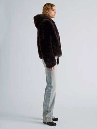Proenza Schouler Side full length image of model wearing Michelle Hooded Shearling in Coffee