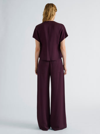Proenza Schouler Back full length image of model wearing Kat Top in Merino Wool in Malbec