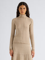 Proenza Schouler Front cropped image of model wearing Stina Turtleneck in Ladder Stripe in Bronze Cream