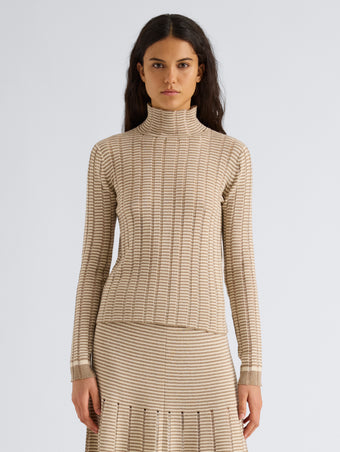 Proenza Schouler Front cropped image of model wearing Stina Turtleneck in Ladder Stripe in Bronze Cream