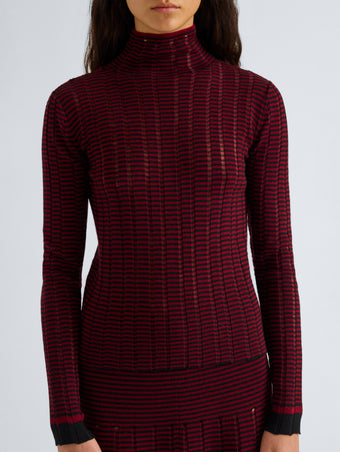 Proenza Schouler Detail image of model wearing Stina Turtleneck in Ladder Stripe in Black Wine