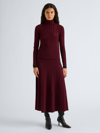 Proenza Schouler Front full length image of model wearing Phyllis Skirt in Ladder Stripe in Black Wine