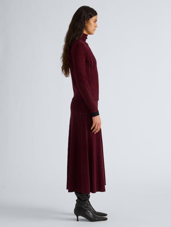 Proenza Schouler Side full length image of model wearing Phyllis Skirt in Ladder Stripe in Black Wine