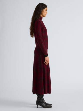 Proenza Schouler Side full length image of model wearing Phyllis Skirt in Ladder Stripe in Black Wine