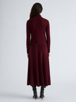 Proenza Schouler Back full length image of model wearing Phyllis Skirt in Ladder Stripe in Black Wine