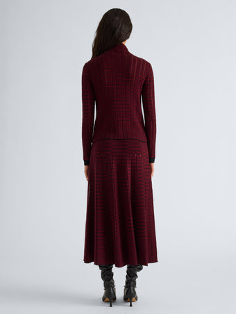 Proenza Schouler Back full length image of model wearing Phyllis Skirt in Ladder Stripe in Black Wine