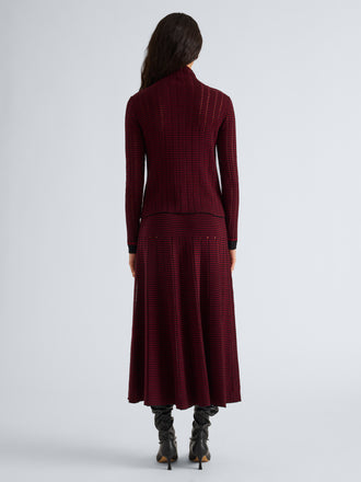 Proenza Schouler Back full length image of model wearing Phyllis Skirt in Ladder Stripe in Black Wine