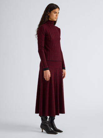 Proenza Schouler Front full length image of model wearing Phyllis Skirt in Ladder Stripe in Black Wine