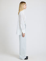 Proenza Schouler Side full length image of model wearing the Weyes Pant in Cotton Viscose Suiting in Pale Grey