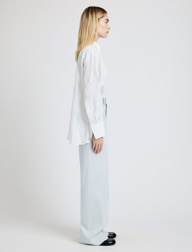 Proenza Schouler Side full length image of model wearing the Weyes Pant in Cotton Viscose Suiting in Pale Grey