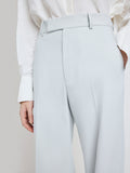 Proenza Schouler Detail image of model wearing the Weyes Pant in Cotton Viscose Suiting in Pale Grey