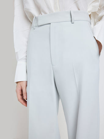 Proenza Schouler Detail image of model wearing the Weyes Pant in Cotton Viscose Suiting in Pale Grey