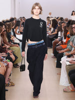 Runway  image of model wearing Stella Sweater In Cashmere Jacquard in black