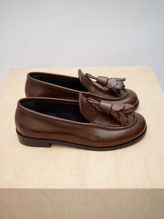 Editorial image of Albers Loafers in Shiny Calf in Cedar on wooden block