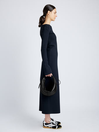 Image of model holding Slide Bag in Smooth Nappa in BLACK