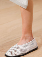 Runway image of the Sqaure Perforated Slippers in cream