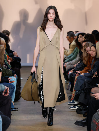 Model in Khaki Wool Felt Dress, Black Embroidered Velvet Dress, Black Cone Ankle Boots, and Walnut Felt XL PS1 Tote