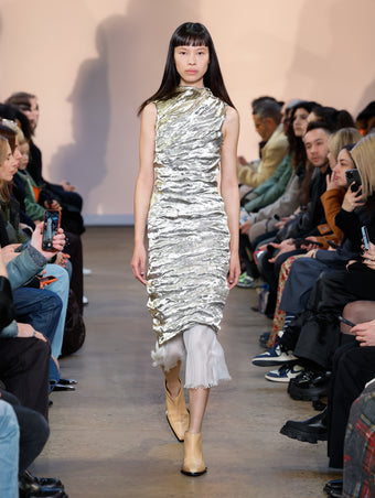 Model in Silver Crushed Metallic Silk Dress and Natural Bronco Ankle Boots
