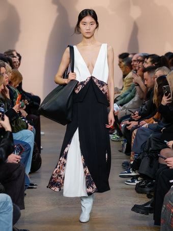 Model in Black Printed Viscose Crepe Dress, Powder Blue Cone Over The Knee Boots, and Black XL PS1 Tote