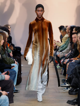 Model in Umber Ice Dyed Velvet Shirt Dress, Stone Cone Over The Knee Boots, Natural Shearling Bar Bag, and Black Leather Gloves
