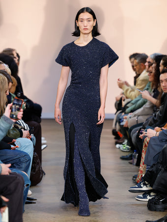Model in Navy Technical Sequin Knit Dress, Black Wool Felt Skirt, and Navy Technical Sequin Knit Over The Knee Boots