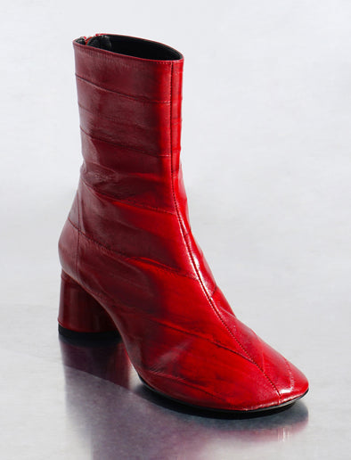 Proenza Schouler 3/4 front editorial image of Monogram Heeled Loafers in Eel in ROSEWOOD