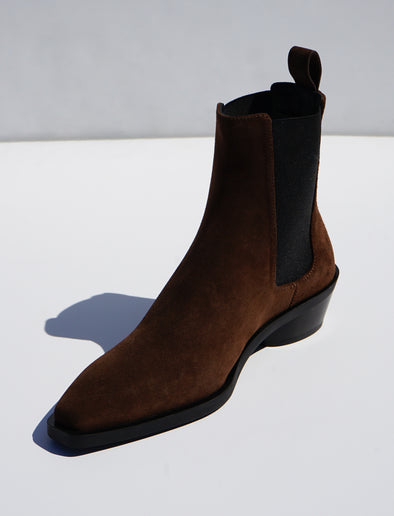 Proenza Schouler 3/4 front editorial image of Bronco Chelsea Boots in DARK BROWN