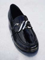 Proenza Schouler 3/4 front editorial image of Monogram Loafers in Eel in BLACK