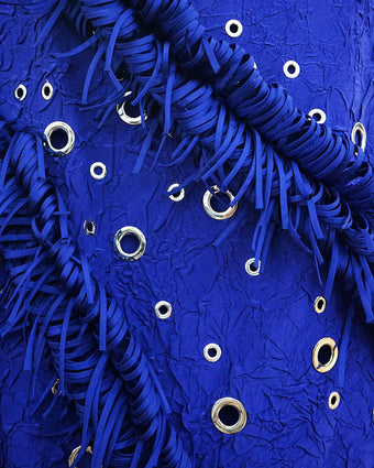 Close shot detail image of grommets and trim on the custom Met Gala gown for Eva Chen