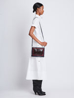 Image of model wearing Triple Zip Pouch in DEEP NAVY/GARNET/MOCHA