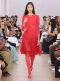 Runway image of model wearing Dara Top In Technical Nylon Jersey in red