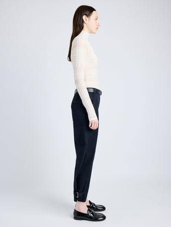 Side full length image of model wearing Cotton Twill Tapered Pants in BLACK