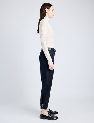 Side full length image of model wearing Cotton Twill Tapered Pants in BLACK
